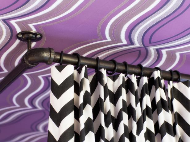 In order for bed drapery to hang properly, itâ  s best to install it on ceiling-mounted hardware. These black and white zig zag drapery panels coordinate perfectly with a wraparound track and drapery rings in a satin black finish.
