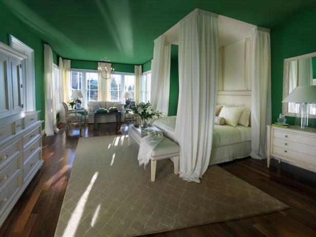 The master bedroom from HGTV Dream Home 2009 is a true glimpse of luxury in design. Luscious green walls allow the crisp white draperies of the canopy bed to stand out and become a dramatic statement piece. Design by Linda Woodrum.