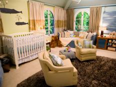 Nurseries can be incredibly arduous spaces to design but Dan shows no fear in tackling this space for actor Jason Priestley and his family. Managing to make it feel both baby-friendly and sophisticated, Dan smartly borrows elements that allude to the sea while avoiding both kitsch and standard nursery fare. A serene painting of the sky graphically hangs from nautical rope above toy storage, while tin whales spouting stars glide across the crib wall. Subtle greens and blues intermingle perfectly while a giant floor mirror (leaning on a wall that has been painted to appear as if the sea is rising on it) beams light back into the space beautifully.