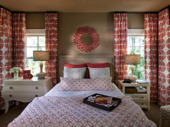Guest Room With Bright Geometric Coral Drapes 