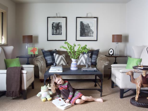 Although the majority of the great room now has vaulted ceilings, Jon decided to keep the sitting room more intimate. In that room, he left the 8-foot ceiling height as-is, and created a furniture arrangement featuring classic, traditional American pieces accented by a pair of architectural etchings.