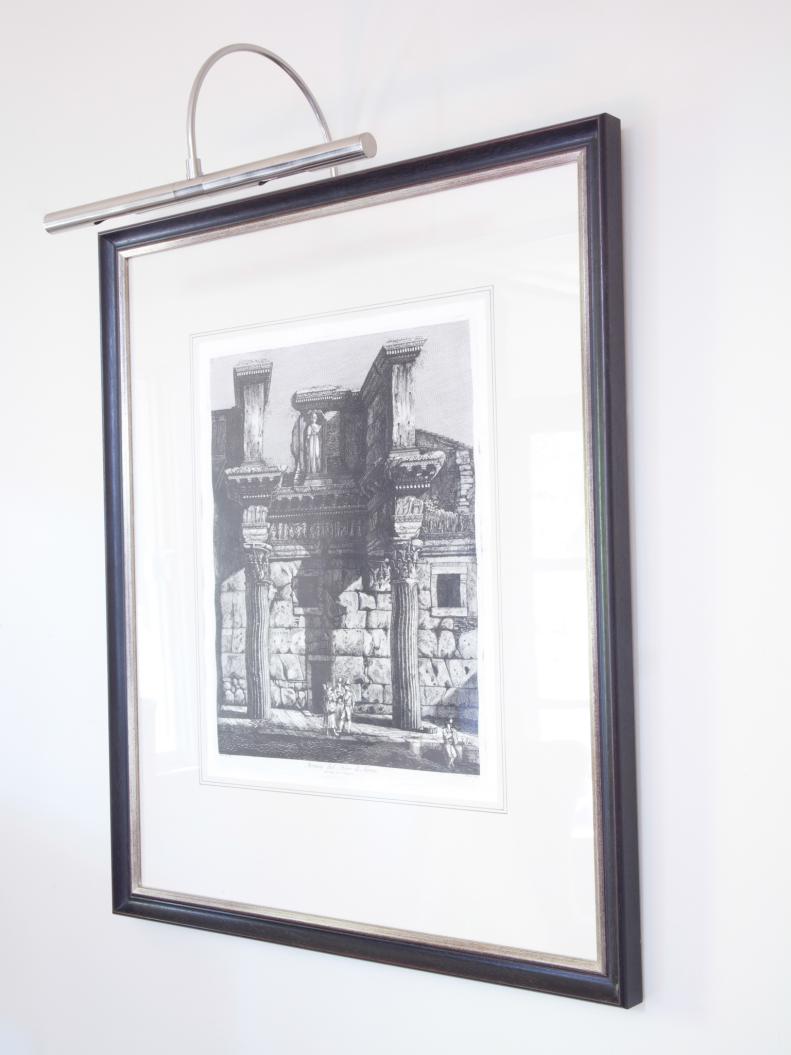 On display over the sofa in the sitting room sits a pair of sixteenth century architectural renderings by Piranesi and Rossini. The renderings were made by cutting wood into blocks, then using them to etch ink markings into paper.