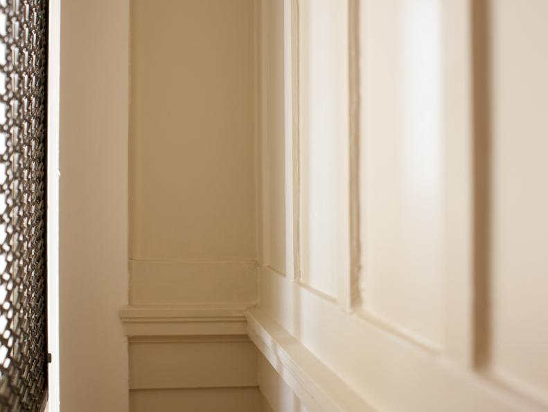 Many of the homes in San Francisco are packed with architectural detail, including the judges paneling in Blairâ  s entryway. To keep the paneling from being too busy, both the molding and the wall itself were painted a neutral shade of taupe.