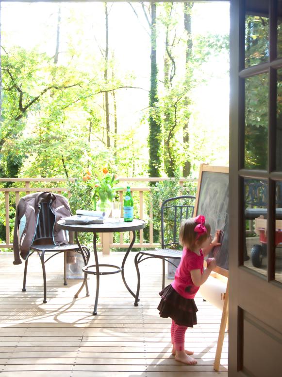 To add extra play space for the kids and room for outdoor entertaining, Jon added 500 square feet of elevated deck just off the great room. To access the deck from the dining room and sitting room, he replaced windows with two pairs of French doors.