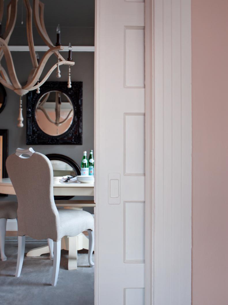 Originally installed to separate the bedroom from a small parlor, the pocket doors now add privacy between the bedroom and the dining room