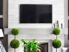 Give your fireplace a contemporary update with a do-it-yourself modern mantel made from mitered wood planks.