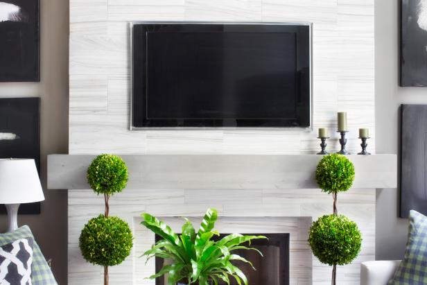 Give your fireplace a contemporary update with a do-it-yourself modern mantel made from mitered wood planks.