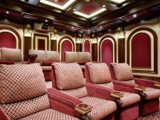 The tiered seating in this home theater, ensures unobstructed visibility from any seat and the wall to wall carpet provides additional sound absorption.