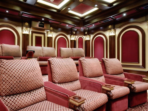 The tiered seating in this home theater, ensures unobstructed visibility from any seat and the wall to wall carpet provides additional sound absorption.