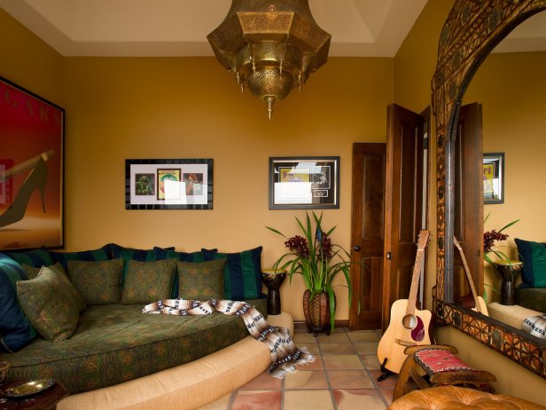 A custom made corner bed scattered with pillows invites guests to sit back and relax.