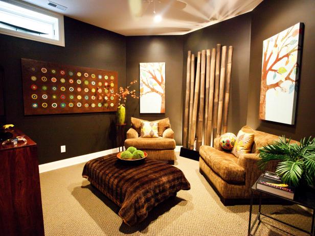 Dark greay walls with vibrant colored paintings give this media room an Asian / Buddha inspired setting.