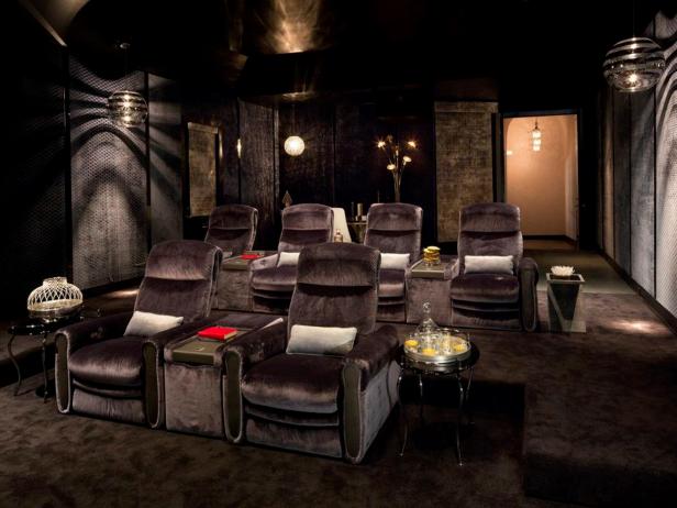 Mix vintage pieces with custom furnishings, Italian fabric panels cover the walls, enchancing the style and sound quality of the theater.  Kari Whitman Interiors