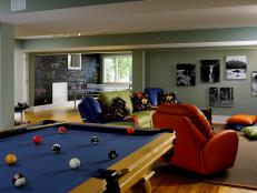 Mediaroom features a play area for young kids with a chalkboard wall and a pool table.  Ample seating and floor pillows provide a spot for everyone.