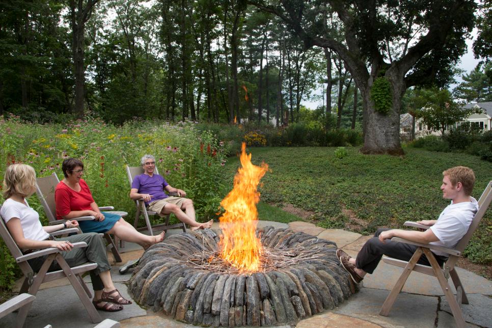 HGTV.com shares 10 beautiful fire pits and outdoor fireplaces that are the perfect place to gather and stay warm on cool summer nights.