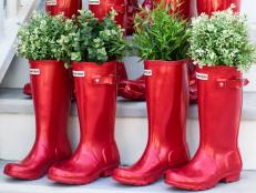 Add a touch of whimsy to your stoop or steps with a grouping of boots used as planters.