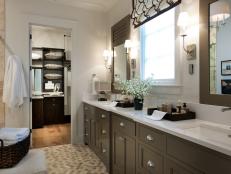 Sophisticated and serene, the master bathroom shines with chrome hardware, a latte color scheme and high-tech features.