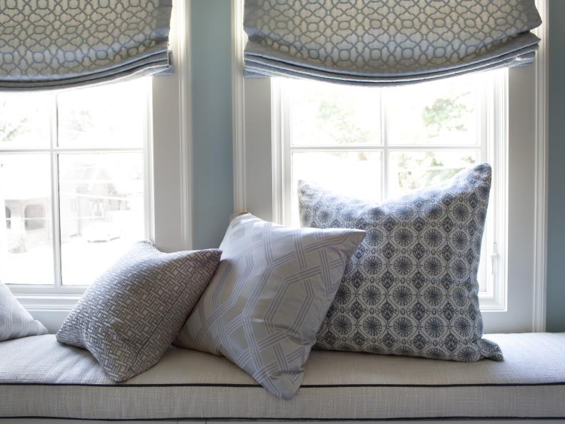 Colorful pillows on window seat