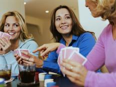 Three women playing cards