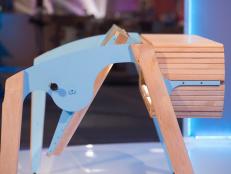 Designer Sef Pinney's design, a wooden multi-functional desk that pivots 360 degrees on its steel frame, is presented on judging day, as seen on Ellen's Design Challenge. This week the designers had to create a multi-functional piece of furniture inspired by a bench-table on which they sat during the challenge reveal without knowing that it was multi-functional. Ellen DeGeneres puts eight furniture designers to the test when they come to Los Angeles to compete in various challenges designing and building amazing furniture creations. With a workshop, a lead carpenter and all the tools they’ll need, the contestants will be tasked with a new build each episode. A panel of expert judges along with appearances by Ellen will eliminate them one by one until one designer is left standing to take home the cash prize and win “Ellen’s Design Challenge.”