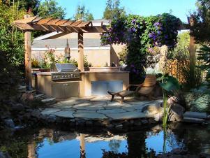 outdoor kitchen surrounded by ornamental pond