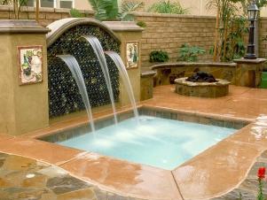 dramatic backyard pool and water feature