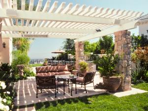 arbor creates shade for concrete patio