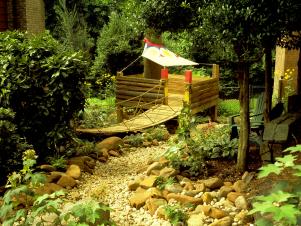 old creek bed pathway leads to kids playhouse