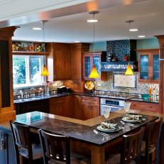 Inviting Eclectic Kitchen Featuring L-Shaped Island, Cabinet Blended Refrigerator and Tile Backsplash 