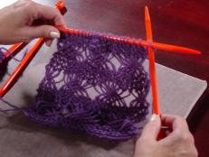 This intermediate knitter's project features an airy eyelet stitch with fluffy-textured yarn.