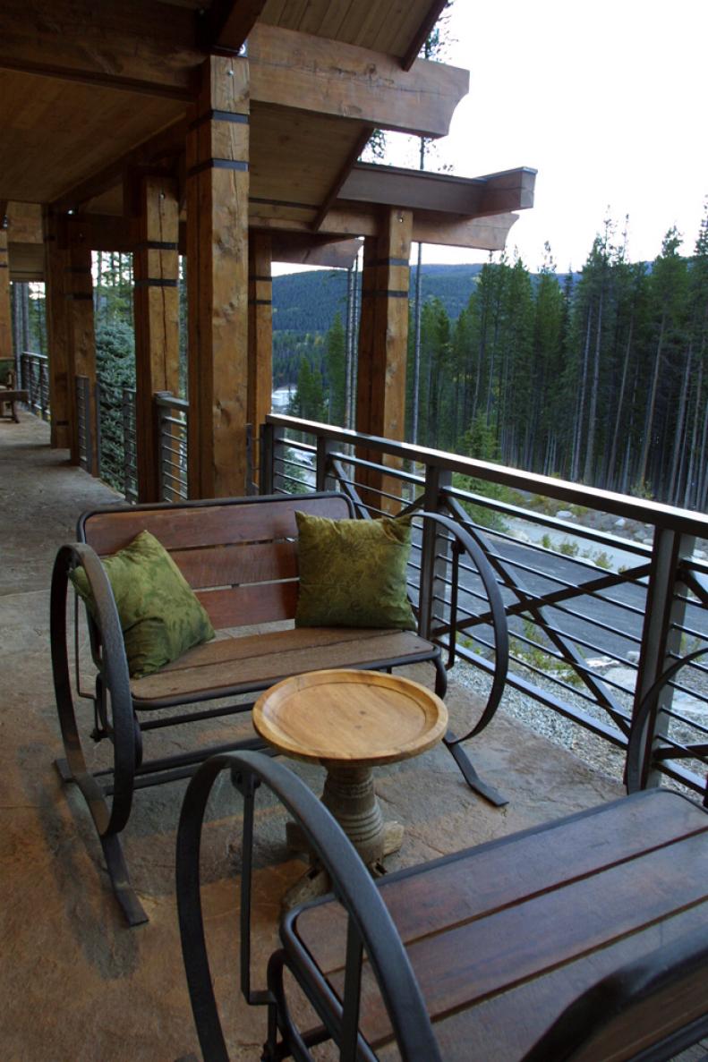 Porch With Wooden Glider Benches and Mountain Views