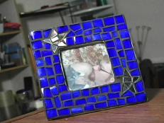 Create a night sky mosaic picture frame from recycled glass pieces.