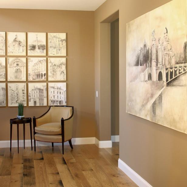 Neutral Sitting Area With Armchair and Artwork