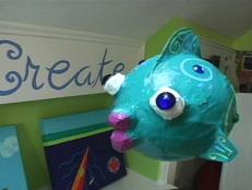 This comical papier mache fish is inexpensive to make and adds whimsy to party decor.