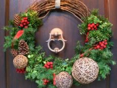 Create a festive holiday wreath of grapevine and evergreen for welcoming guests to your home.