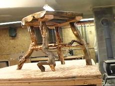 Construct a unique, natural side table from gnarled tree branches and logs.