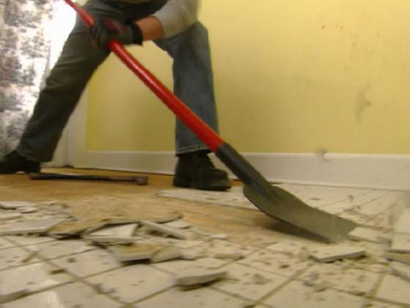 Scrape old tile to the subflooring.