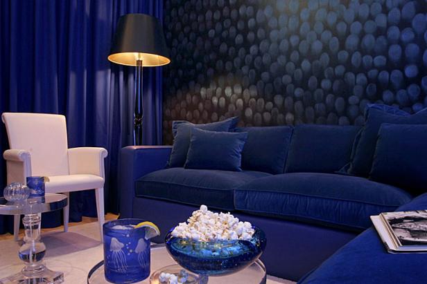 Blue Leather Sofa with Blue Walls and Curtains 