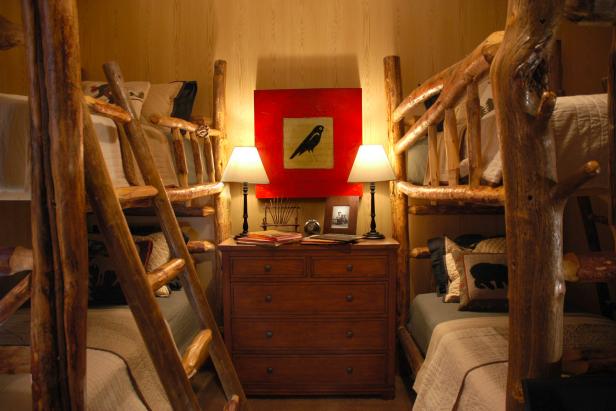 Log Cabin Kids' Room With Natural Wood Bunk Beds and Dresser