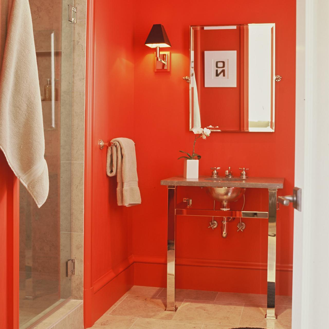 tan bathroom with red accents