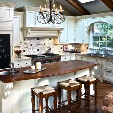 Traditional White Kitchen With Wood Accents and Iron Chandelier 