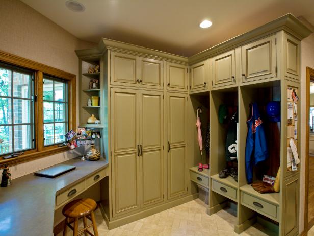 Mudroom With Green Cabinets And Cubbies 