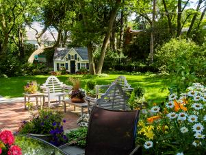 whimsical backyard garden includes playhouse