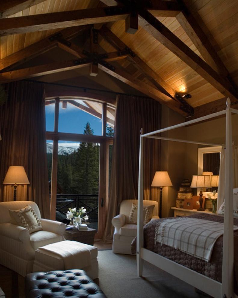 Rustic Neutral Bedroom With Vaulted Wood Ceiling and White Canopy Bed