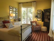 A happy corner bedroom, which boasts a sublime north-facing view of Sonoma's rolling hills, becomes the perfect home away from home for visiting guests.