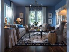 A soothing palette in blues and intriguing artwork prove a winning combination in this elegant yet earthy gathering space.