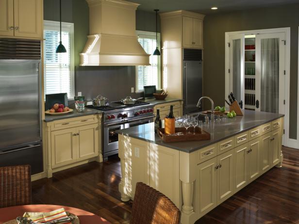 refrigerator next to stove in kitchen