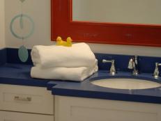 With a subtle nod to nautical, the kids' bathroom makes bubble-bath time a treat.