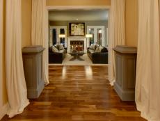 A grand receiving area, complete with gleaming walnut floors, offers a warm welcome to guests.