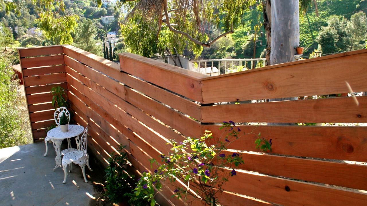How to Build a Horizontal Plank Fence in a Hillside Backyard HGTV