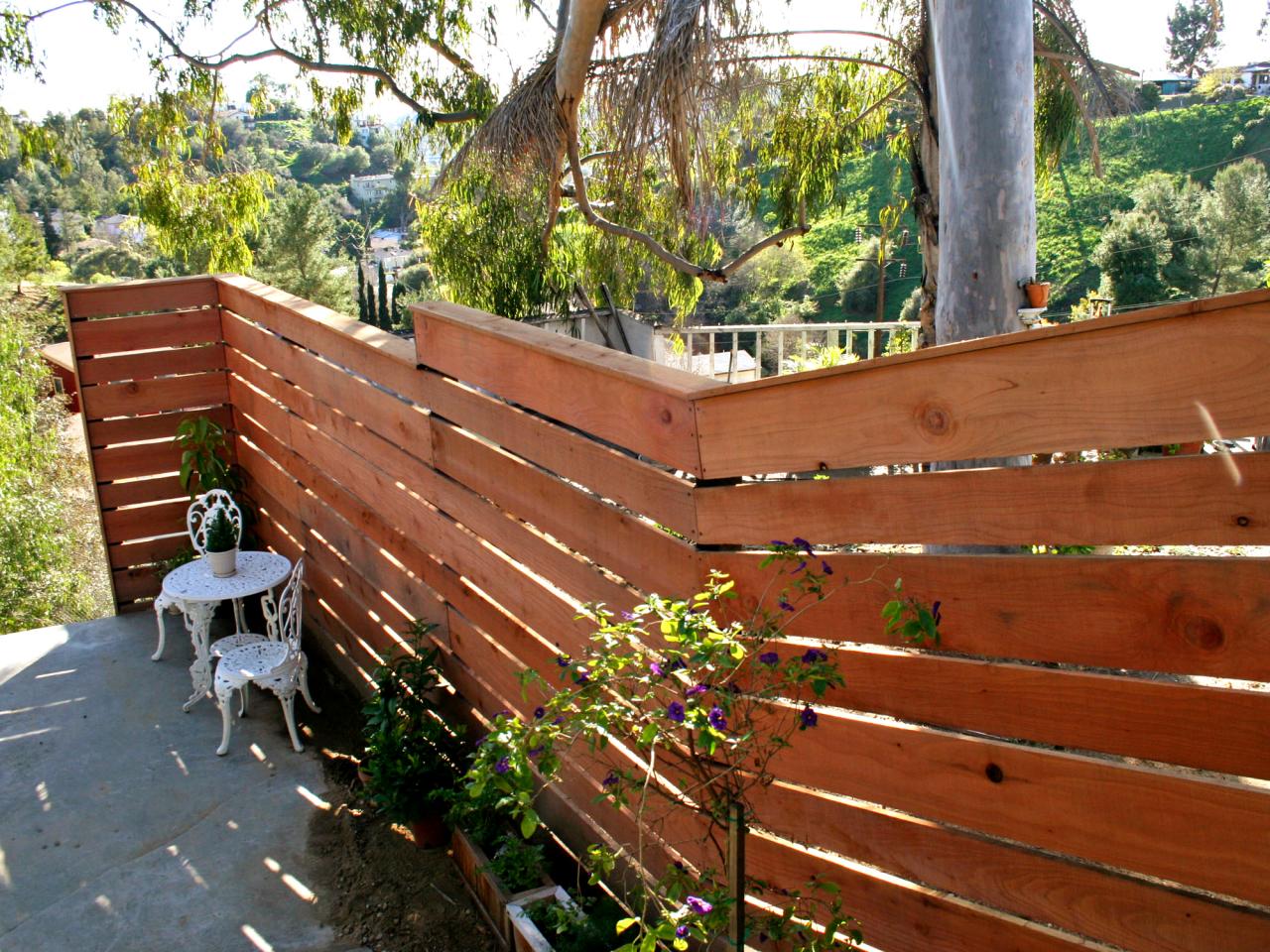 How to Build a Horizontal Plank Fence in a Hillside Backyard